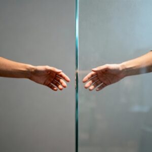 Two hands almost touching, symbolizing pre-marital relationship boundaries in Pakistani culture